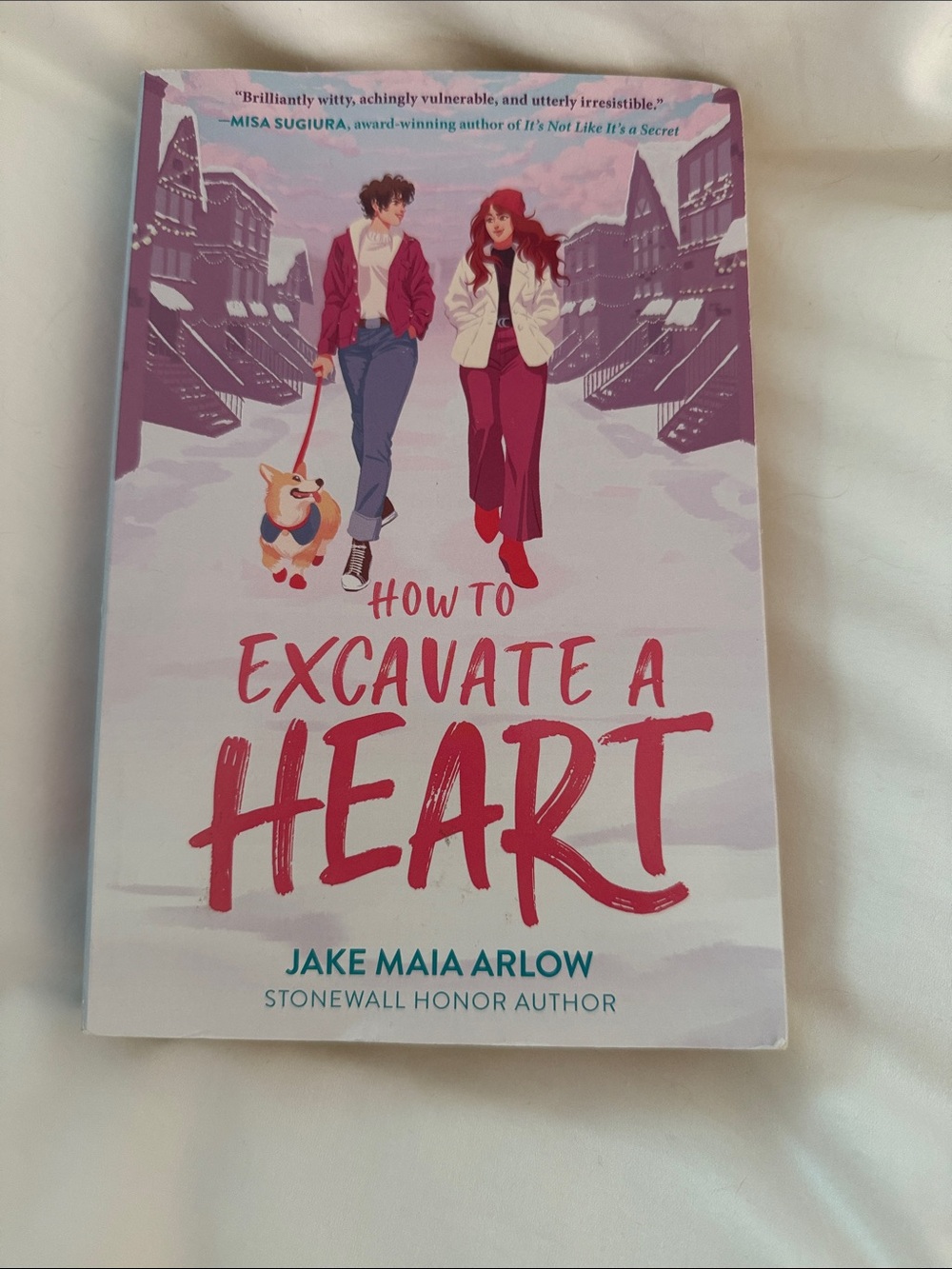 Harper Teen paperback with pink, cream, red and purple corgi cover